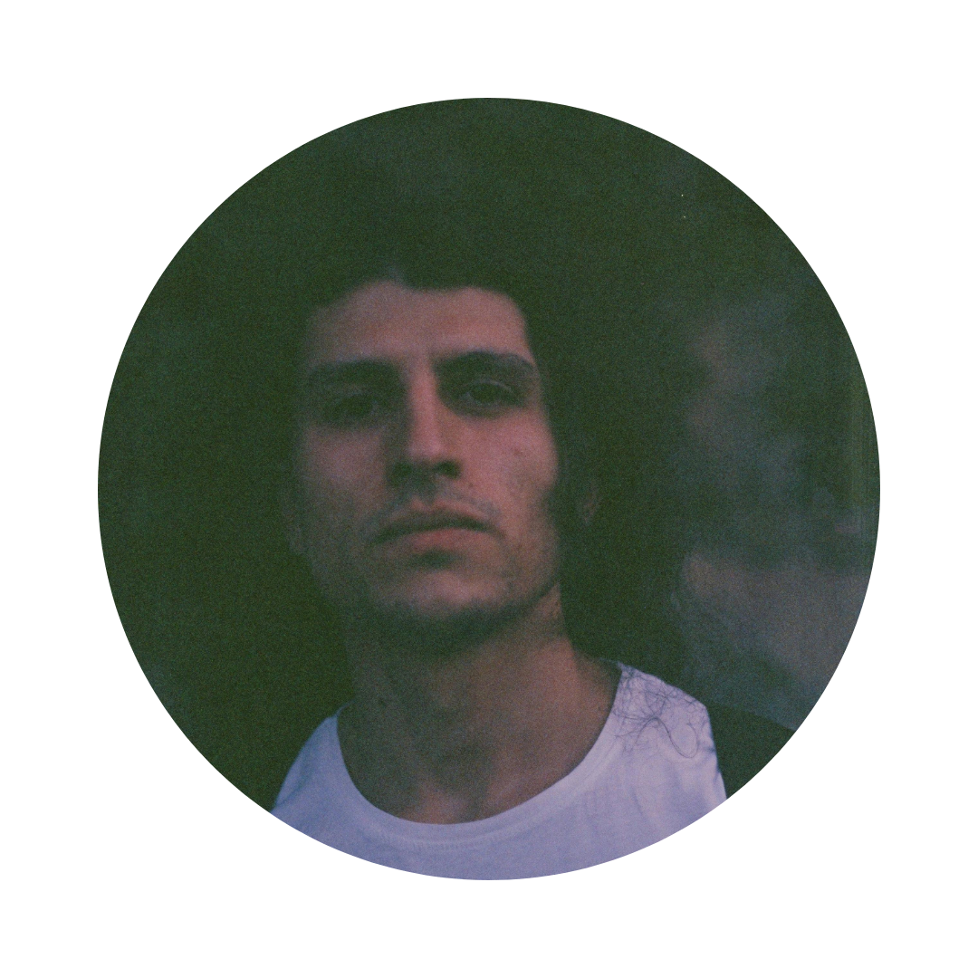 Circular portrait of a person with a dark background