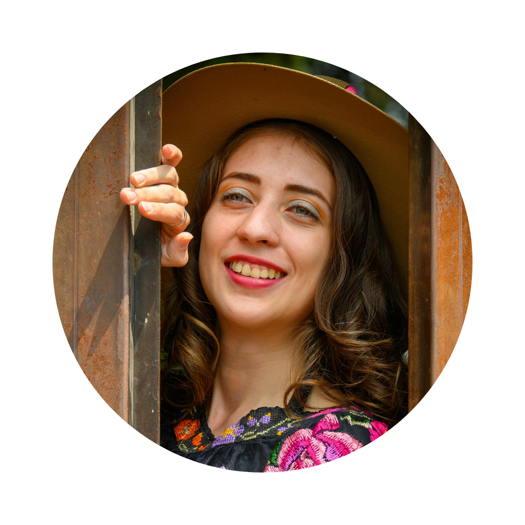 Woman peeking out from behind a wooden panel with a smile